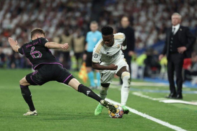 Vini Jr ganhou a maioria das disputas contra Kimmich na semifinal da Champions - Foto: Thomas Coex/AFP via Getty Images - (crédito: Thomas Coex/AFP via Getty Images) Vini Jr ganhou a maioria das disputas contra Kimmich na semifinal da Champions - Foto: Thomas Coex/AFP via Getty Images - (crédito: Thomas Coex/AFP via Getty Images)