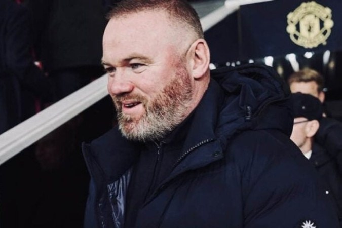 O ex-atacante Wayne Rooney em visita ao Manchester United -  (crédito: Foto: Instagram @waynerooney)