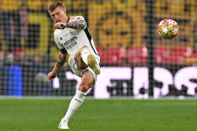 Toni Kroos comemora gol do Real Madrid na final da Champions contra o Dortmund - Foto: Glyn Kirk/AFP via Getty Images -  (crédito: Glyn Kirk/AFP via Getty Images)