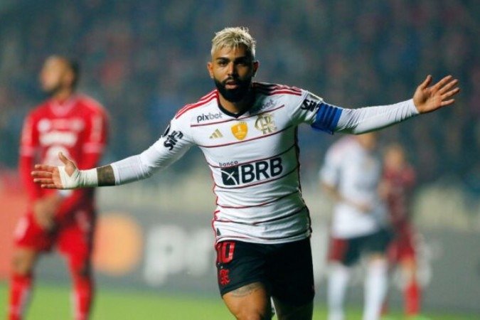 Flamengo's forward Gabriel Barbosa celebrates after scoring during the Copa Libertadores group stage second leg football match between Chile's Ã?ublense and Brazil's Flamengo, at the Municipal stadium in Concepcion, Chile, on May 24, 2023. (Photo by JAVIER TORRES / AFP) (Photo by JAVIER TORRES/AFP via Getty Images)
- (crédito: AFP via Getty Images) Flamengo's forward Gabriel Barbosa celebrates after scoring during the Copa Libertadores group stage second leg football match between Chile's Ã?ublense and Brazil's Flamengo, at the Municipal stadium in Concepcion, Chile, on May 24, 2023. (Photo by JAVIER TORRES / AFP) (Photo by JAVIER TORRES/AFP via Getty Images)
- (crédito: AFP via Getty Images)