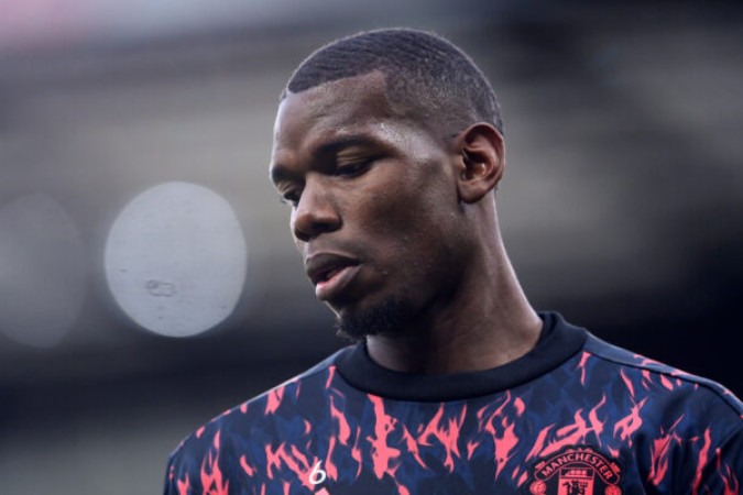  MANCHESTER, ENGLAND - FEBRUARY 12: Paul Pogba of Manchester United warms up prior to the Premier League match between Manchester United and Southampton at Old Trafford on February 12, 2022 in Manchester, England. (Photo by Laurence Griffiths/Getty Images)
      Caption  -  (crédito:  Getty Images)