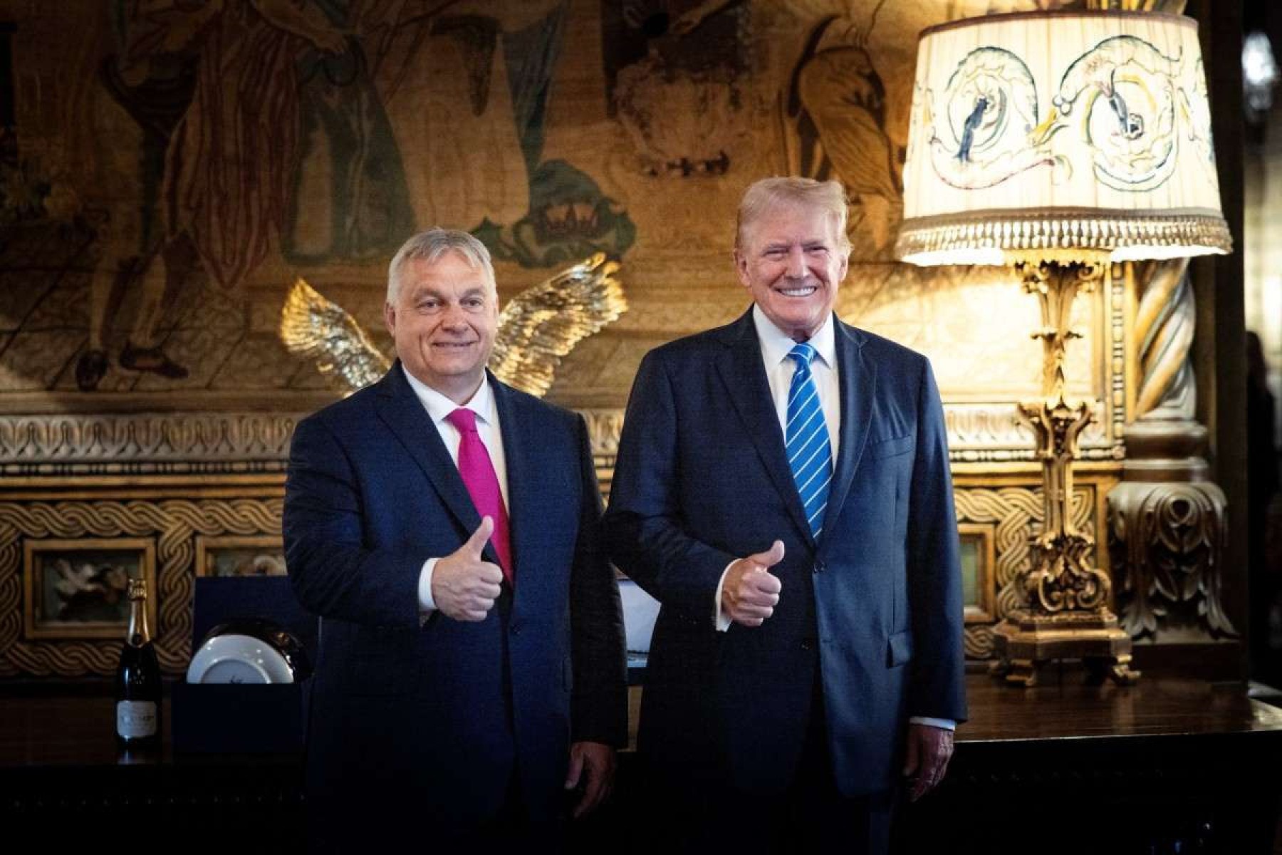  TOPSHOT - In this handout photograph taken and released by the Hungarian Prime Minister's Office on July 11, 2024, Hungary's Prime Minister Viktor Orban (L) poses with former US president Donald Trump at Trump's estate in Mar-a-Lago in Palm Beach, Florida. Hungary's Prime Minister Viktor Orban flew to Florida on July 11, 2024, to meet with former US President Donald Trump after the end of the NATO summit in Washington D.C. (Photo by ZOLTAN FISCHER / X ACCOUNT OF HUNGARY'S PRIME MINISTER VIKTOR ORBAN / AFP) / RESTRICTED TO EDITORIAL USE - MANDATORY CREDIT "AFP PHOTO /Hungary's Prime Minister's Office/Miniszterelnöki Sajtóiroda " - NO MARKETING NO ADVERTISING CAMPAIGNS - DISTRIBUTED AS A SERVICE TO CLIENTS       