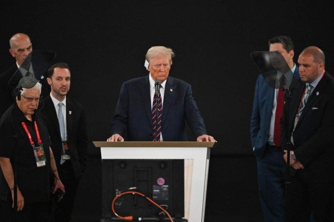  Former US president and Republican presidential candidate Donald Trump stands at the lectern during a sound check on the third day of the 2024 Republican National Convention at the Fiserv Forum in Milwaukee, Wisconsin, on July 17, 2024. Days after he survived an assassination attempt Donald Trump won formal nomination as the Republican presidential candidate and picked Ohio US Senator J.D. Vance for running mate. (Photo by ANDREW CABALLERO-REYNOLDS / AFP)
      