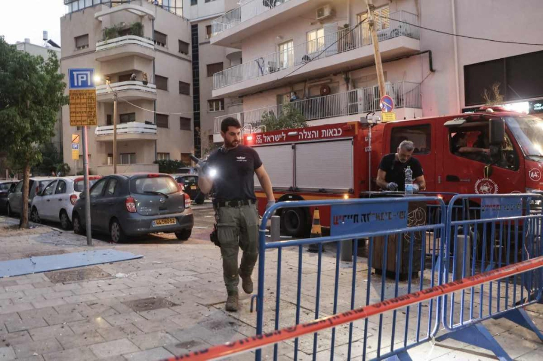  Israeli policemen search the scene at a cordoned-off area where an explosion took place in Tel Aviv on July 19, 2024. The explosion on July 19 was 