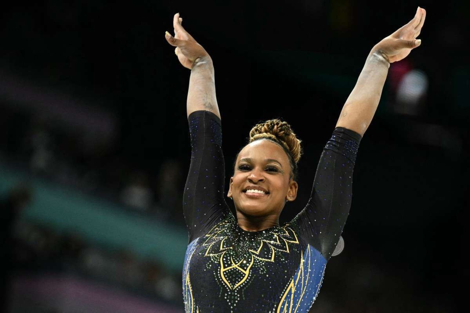  Brazils Rebeca Andrade reacts after competing in the balance beam event of the artistic gymnastics womens qualification during the Paris 2024 Olympic Games at the Bercy Arena in Paris, on July 28, 2024. (Photo by Lionel BONAVENTURE / AFP)       