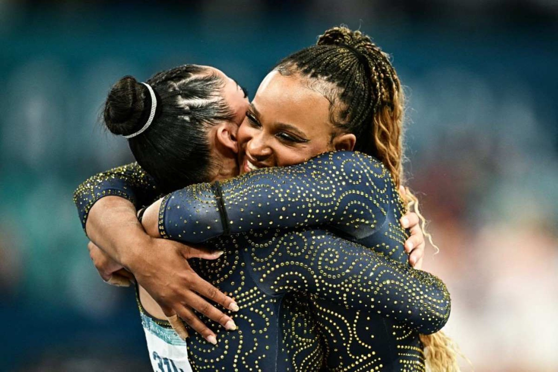  Brazils Rebeca Andrade celebrates as Brazils team finishes second-placed after the artistic gymnastics womens team final during the Paris 2024 Olympic Games at the Bercy Arena in Paris, on July 30, 2024. (Photo by Gabriel BOUYS / AFP)       