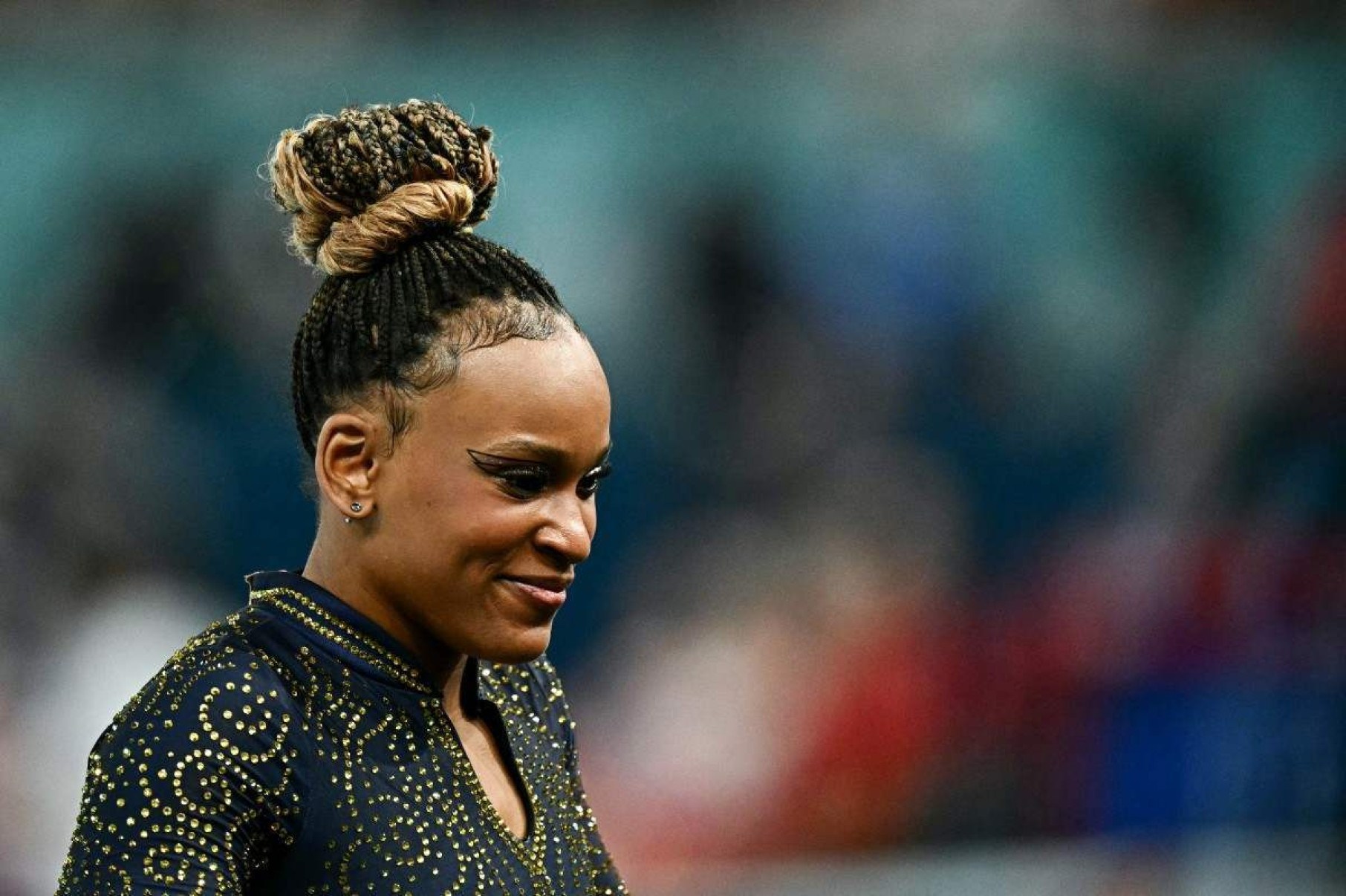  Brazils Rebeca Andrade smiles during the artistic gymnastics womens team final during the Paris 2024 Olympic Games at the Bercy Arena in Paris, on July 30, 2024. (Photo by Gabriel BOUYS / AFP)       