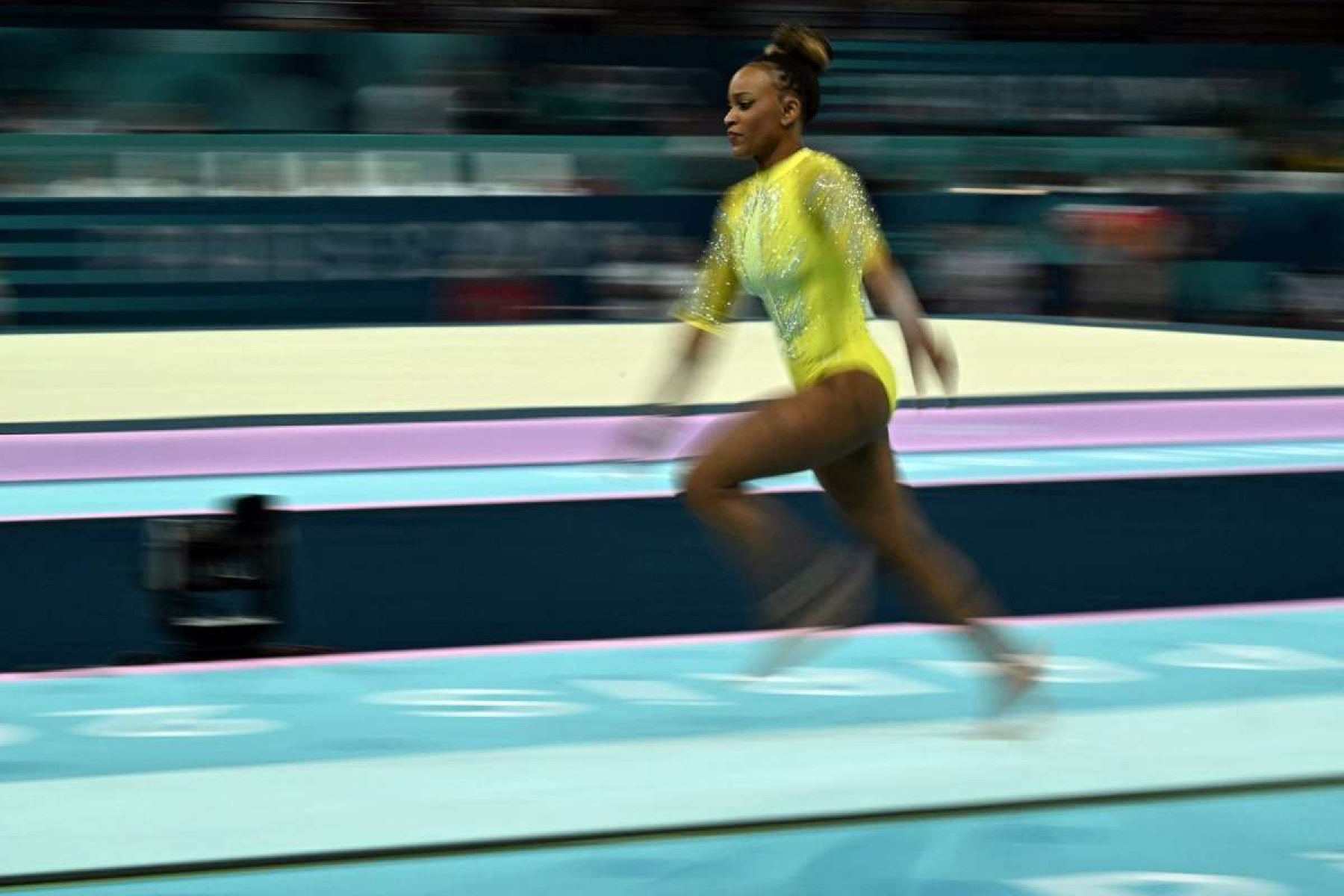  Brazils Rebeca Andrade competes in the vault event of the artistic gymnastics womens all around final during the Paris 2024 Olympic Games at the Bercy Arena in Paris, on August 1, 2024. (Photo by Lionel BONAVENTURE / AFP)       