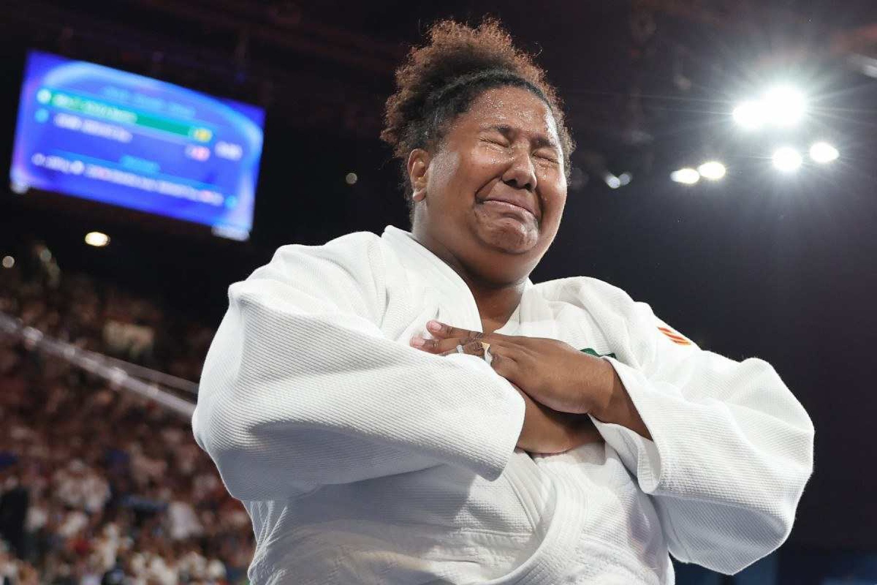  Brazils Beatriz Souza reacts after beating Israels Raz Hershko (Blue) in the judo womens +78kg gold medal bout of the Paris 2024 Olympic Games at the Champ-de-Mars Arena, in Paris on August 2, 2024. (Photo by Jack GUEZ / AFP)       