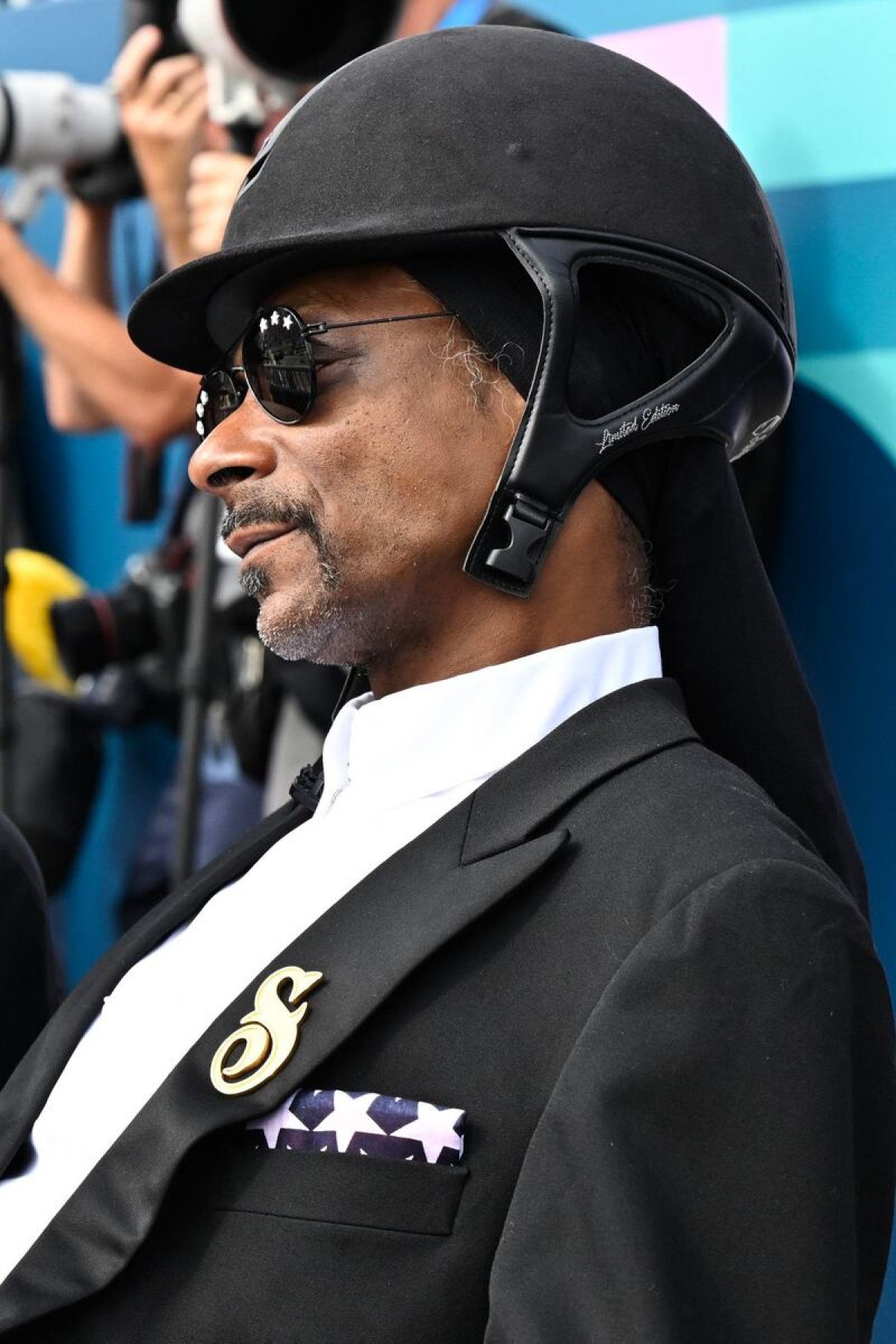 Snoop Dogg, rapper e produtor musical norte-americano, participa da final de adestramento da equipe equestre durante os Jogos Olímpicos de Paris 2024, no Chateau de Versailles, em Versalhes, na periferia oeste de Paris, em 3 de agosto de 2024. 