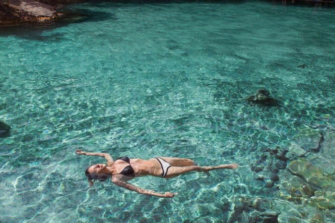 Tomar banho de mar gera uma sensação de bem estar -  (crédito: Getty Images)