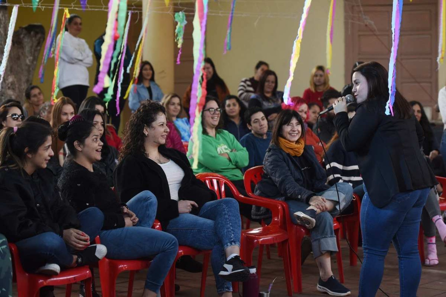  An inmate performs her monologue during the closing of a stand-up comedy workshop at the El Buen Pastor womens prison in Asuncion on August 10, 2024. The Paraguayan NGO Corazon Libre (Free Heart) held a two-month stand-up comedy workshop with the participation of a dozen inmates to help them reintegrate into the labor market upon their release from prison. (Photo by DANIEL DUARTE / AFP)       