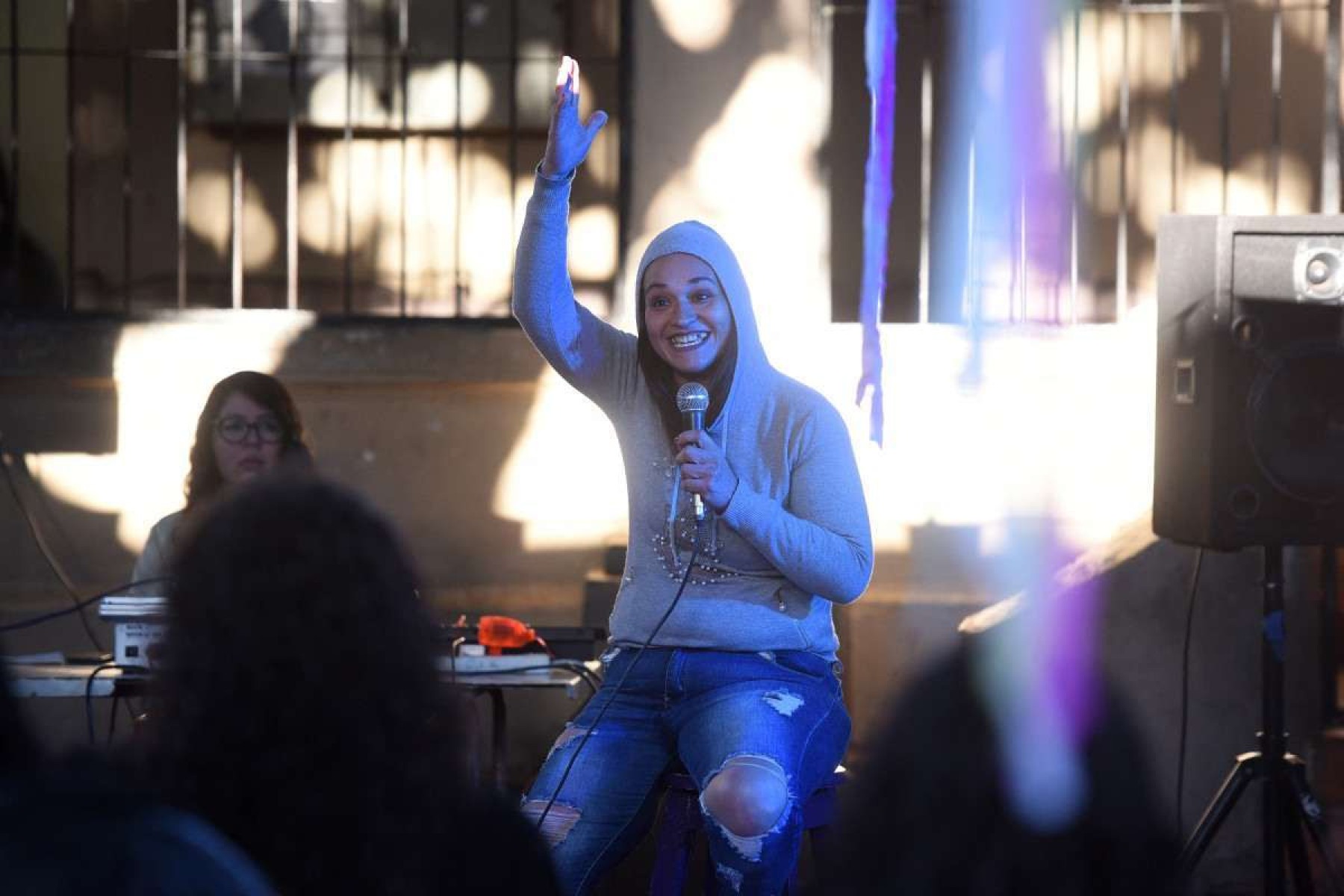  An inmate performs her monologue during the closing of a stand-up comedy workshop at the El Buen Pastor womens prison in Asuncion on August 10, 2024. The Paraguayan NGO Corazon Libre (Free Heart) held a two-month stand-up comedy workshop with the participation of a dozen inmates to help them reintegrate into the labor market upon their release from prison. (Photo by DANIEL DUARTE / AFP)       