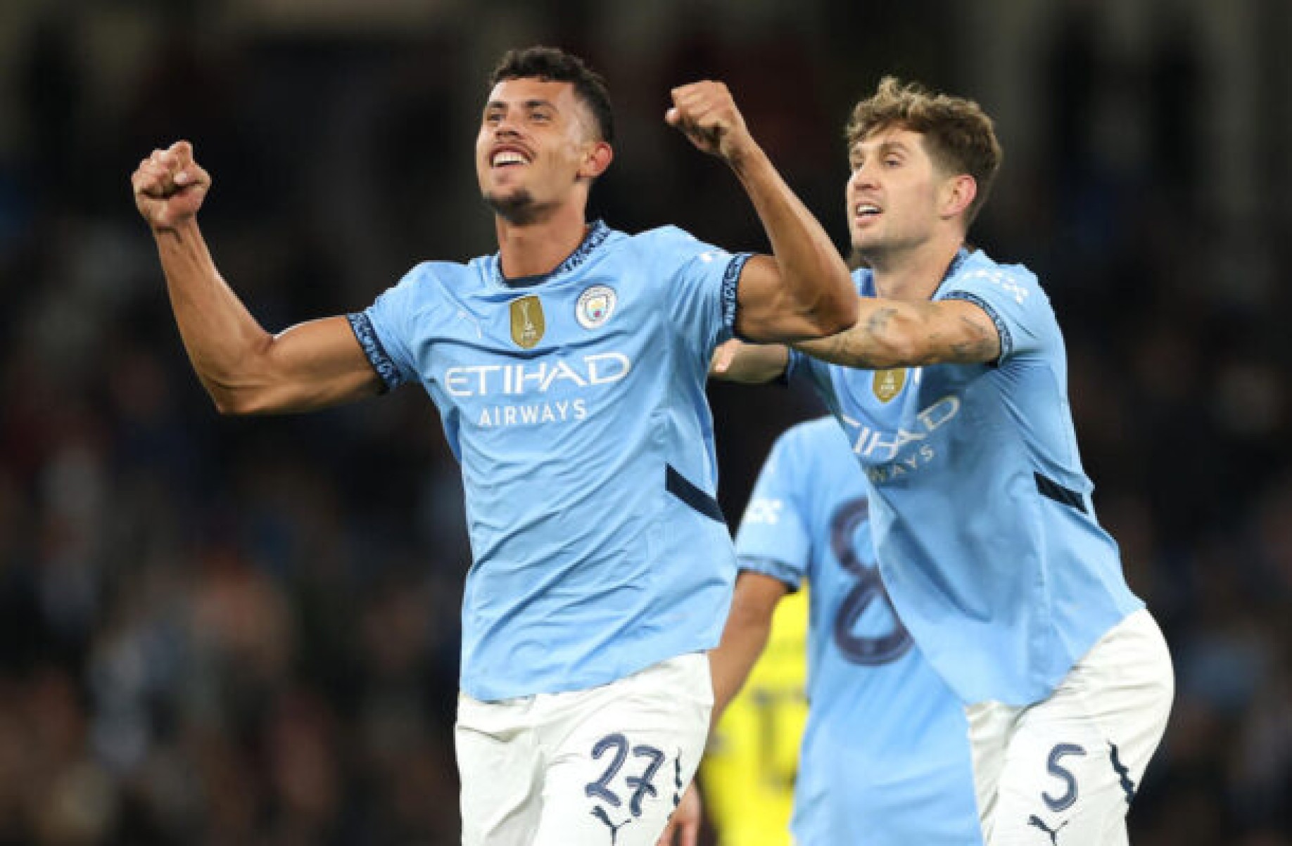  MANCHESTER, ENGLAND - SEPTEMBER 24: Matheus Nunes of Manchester City (left) celebrates with teammate John Stones after scoring his team's second goal during the Carabao Cup Third Round match between Manchester City and Watford  at Etihad Stadium on September 24, 2024 in Manchester, England. (Photo by Carl Recine/Getty Images)
      Caption  -  (crédito:  Getty Images)