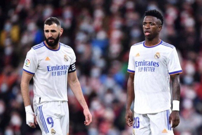BILBAO, SPAIN - DECEMBER 22: Vinicius Junior and Karim Benzema of Real Madrid look on during the LaLiga Santander match between Athletic Club and Real Madrid CF at San Mames Stadium on December 22, 2021 in Bilbao, Spain. (Photo by Juan Manuel Serrano Arce/Getty Images)
- (crédito: Getty Images) BILBAO, SPAIN - DECEMBER 22: Vinicius Junior and Karim Benzema of Real Madrid look on during the LaLiga Santander match between Athletic Club and Real Madrid CF at San Mames Stadium on December 22, 2021 in Bilbao, Spain. (Photo by Juan Manuel Serrano Arce/Getty Images)
- (crédito: Getty Images)