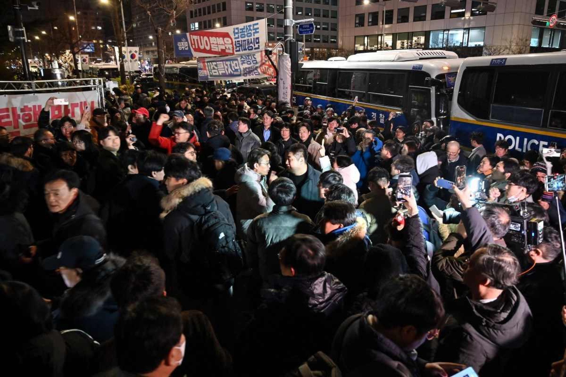  People gather in front of the main gate of the National Assembly in Seoul, South Korea on December 4, 2024, after President Yoon Suk Yeol declared emergency martial law. South Koreas President Yoon Suk Yeol on December 3 declared emergency martial law, saying the step was necessary to protect the country from 