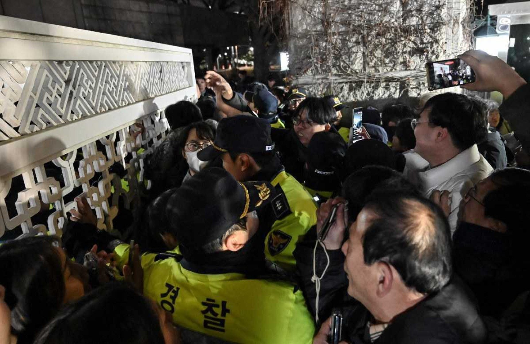  Police attempt to hold back people trying to enter the National Assembly in front of the main gate of the National Assembly in Seoul, South Korea on December 3, 2024, after President Yoon Suk Yeol declared emergency martial law. South Koreas President Yoon Suk Yeol on December 3 declared emergency martial law, saying the step was necessary to protect the country from 