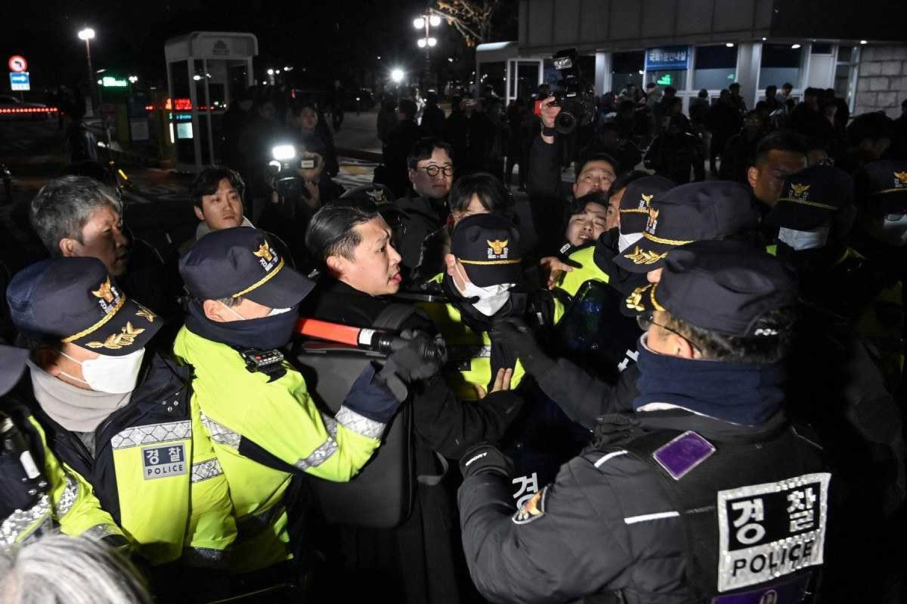  Police attempt to hold back people trying to enter the National Assembly in front of the main gate of the National Assembly in Seoul, South Korea on December 3, 2024, after President Yoon Suk Yeol declared emergency martial law. South Koreas President Yoon Suk Yeol on December 3 declared emergency martial law, saying the step was necessary to protect the country from 