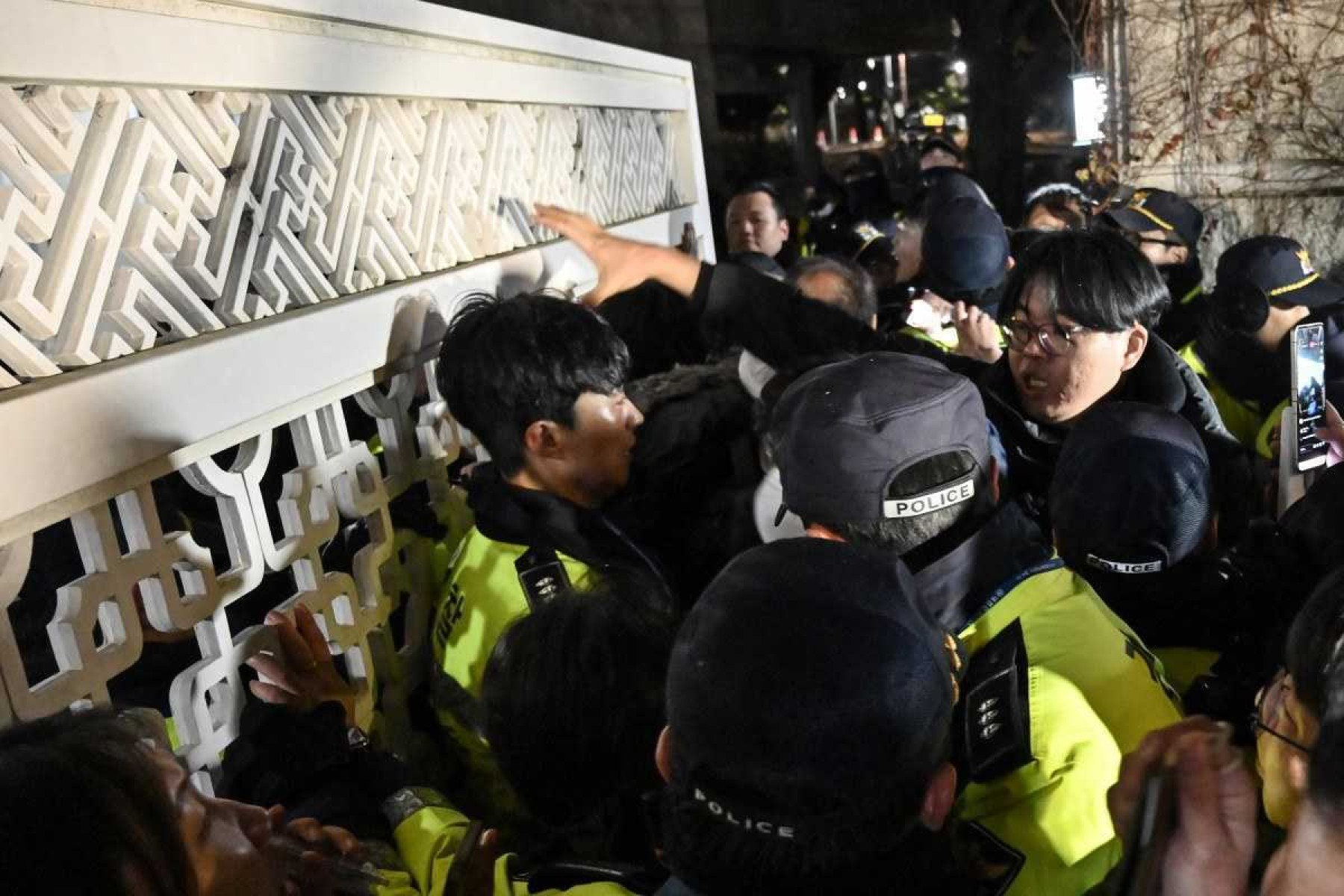  Police attempt to hold back people trying to enter the National Assembly in front of the main gate of the National Assembly in Seoul, South Korea on December 3, 2024, after President Yoon Suk Yeol declared emergency martial law. South Koreas President Yoon Suk Yeol on December 3 declared emergency martial law, saying the step was necessary to protect the country from 