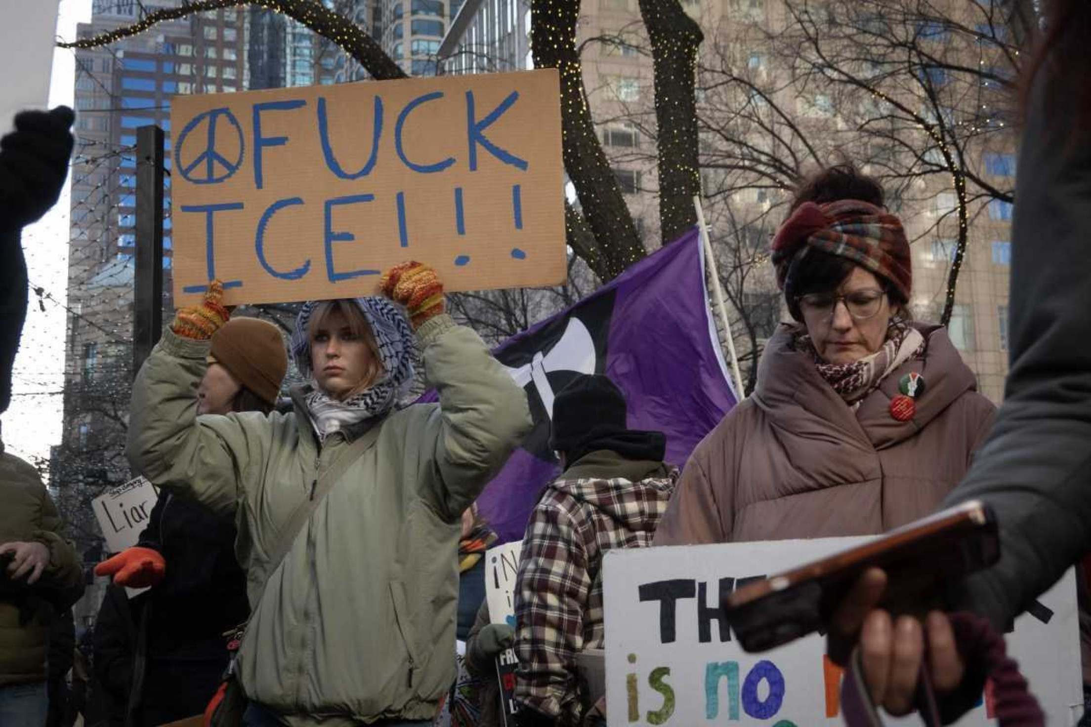  CHICAGO, ILLINOIS - JANUARY 25: (Editors note: Image contains profanity) Activists protest the agenda of President Trump during a rally near the water tower on the Magnificent Mile on January 25, 2025 in Chicago, Illinois. A coalition of activist groups, including those supporting Palestine, immigrant rights, LGBTQ rights and womens rights held a rally along the Magnificent Mile before marching down Michigan Avenue to their destination near Trump Tower.   Scott Olson/Getty Images/AFP (Photo by SCOTT OLSON / GETTY IMAGES NORTH AMERICA / Getty Images via AFP)       