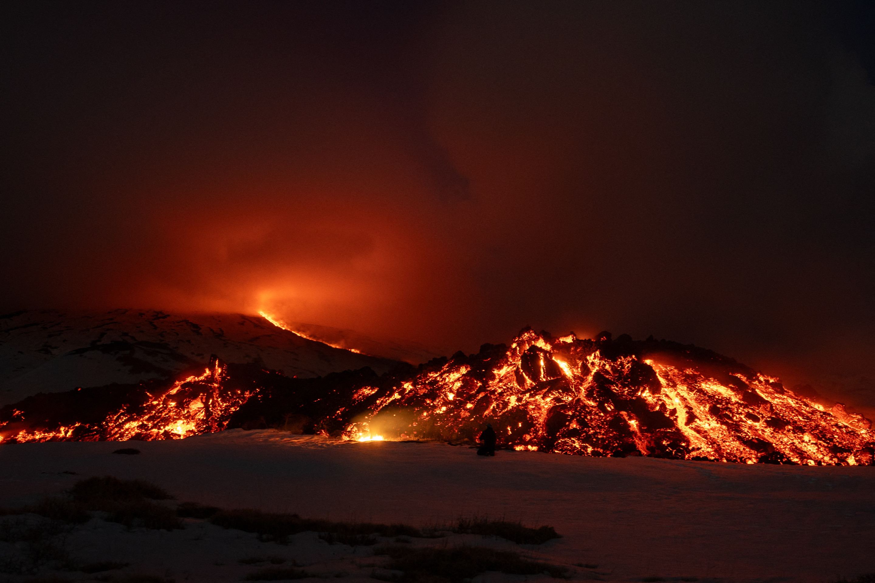  Lava flows from a fracture on the Mount Etna during an eruption of the volcano on February 14, 2025. (Photo by Etna Walk / AFP)       