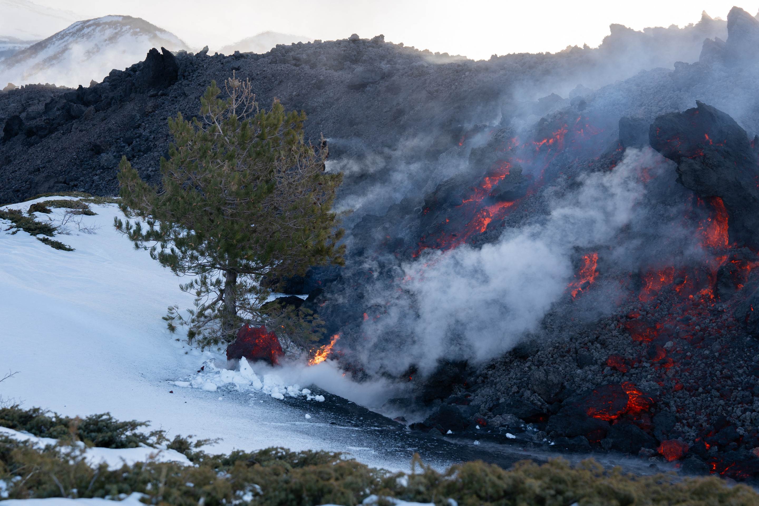  Lava flows from a fracture on the Mount Etna during an eruption of the volcano on February 14, 2025. (Photo by Etna Walk / AFP)       