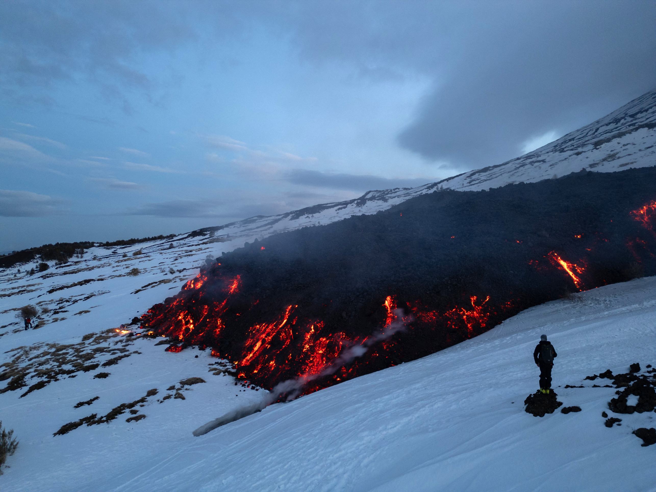  Lava flows from a fracture on the Mount Etna during an eruption of the volcano on February 14, 2025. (Photo by Etna Walk / AFP)       