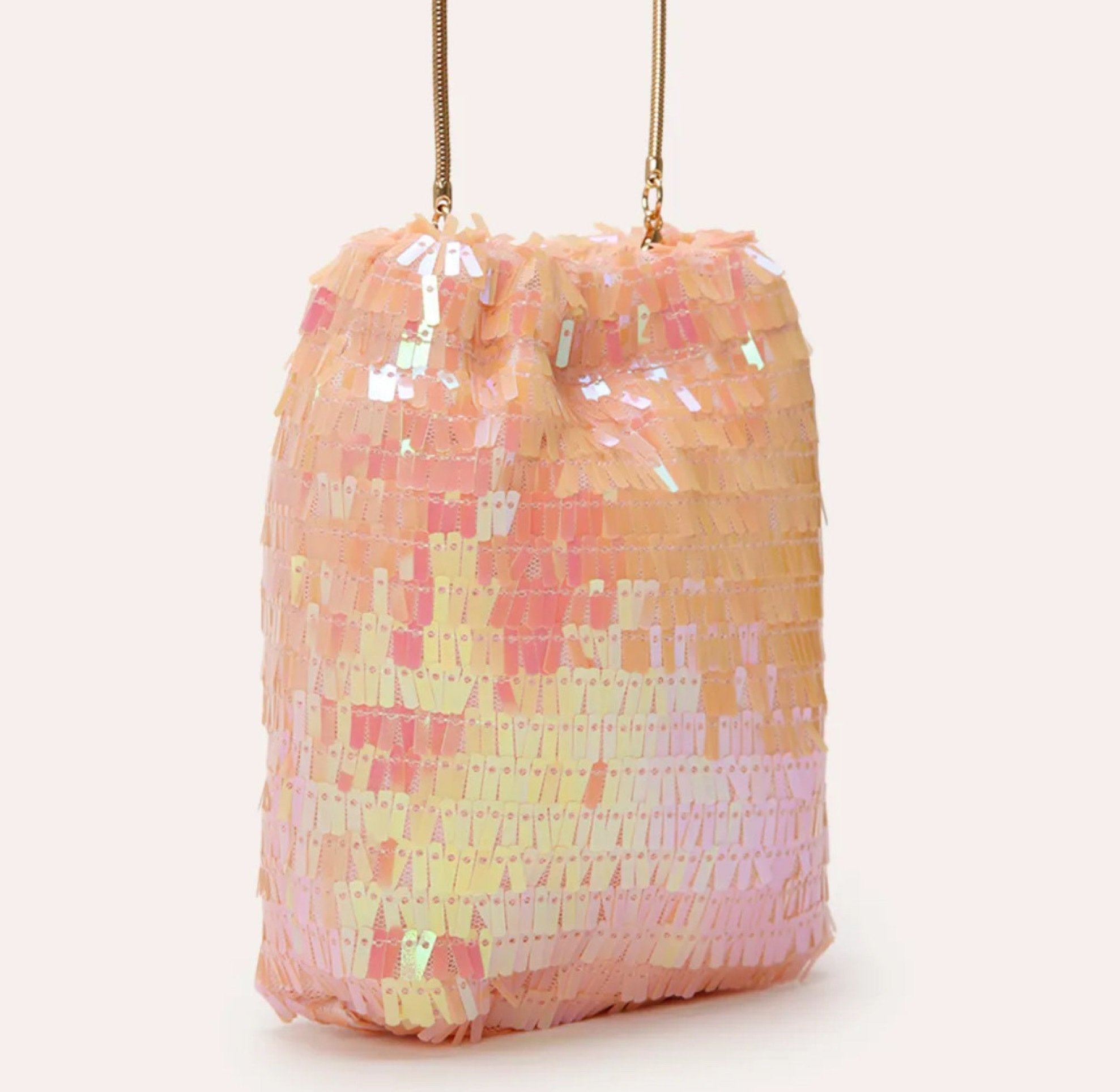 Bolsa phone bag de paetê rosa, da C&A (R$ 99,99)