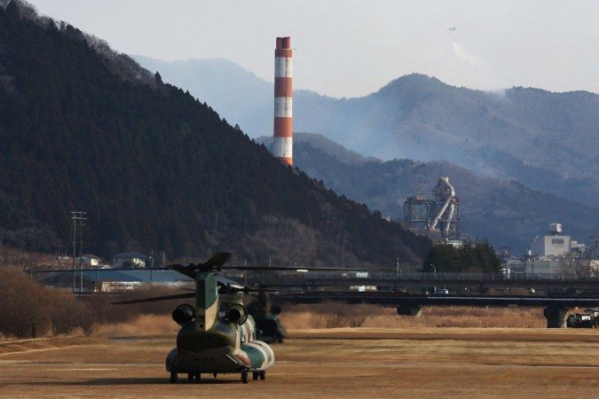 A causa do incêndio ainda é desconhecida neste momento -  (crédito: JIJI Press / AFP)