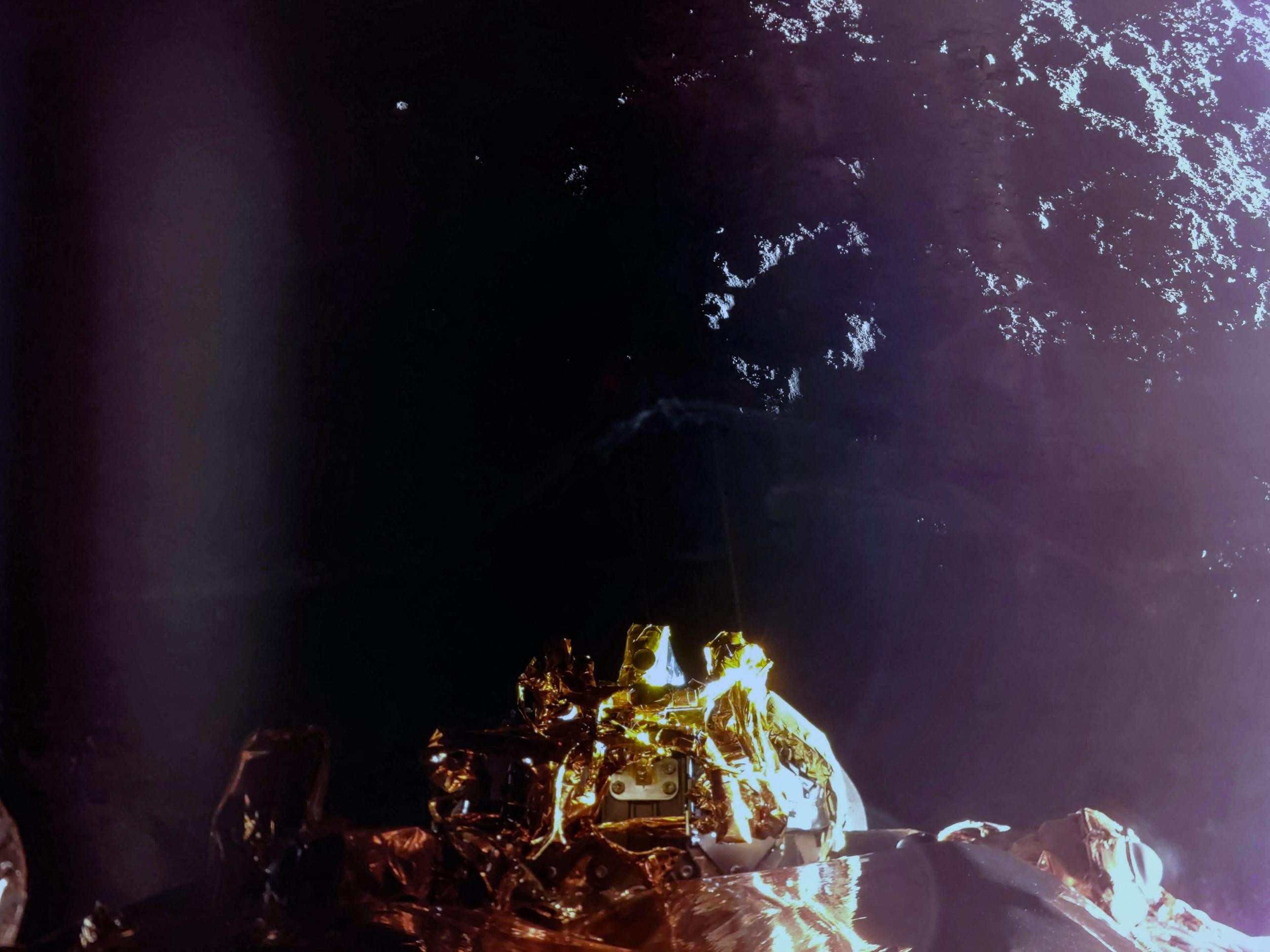  In this handout photograph taken and released by Firefly Aerospace on March 2, 2025, the Fireflys Blue Ghost lander manoeuvres its lunar landing as part of the Ghost Mission 1. A US company successfully landed its spacecraft on the Moon on March 2, 2025, making it only the second private lander to achieve this milestone, a live webcast from mission control showed. Firefly Aerospaces Blue Ghost Mission 1 touched down at 3:34 am US Eastern Time (0834 GMT) near Mons Latreille, a volcanic formation in Mare Crisium on the Moons northeastern near side. (Photo by Handout / Firefly Aerospace / AFP) / RESTRICTED TO EDITORIAL USE - MANDATORY CREDIT 
