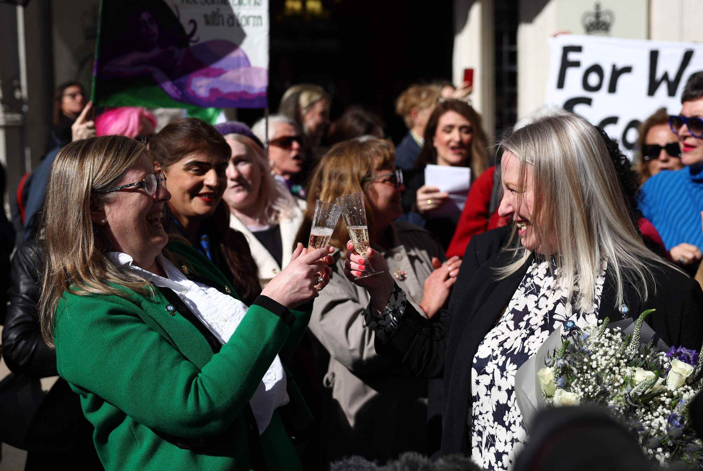  Susan Smith (L) and Marion Calder, Directors of For Women Scotland celebrate outside Britains Supreme Court in London on April 16, 2025, following the courts ruling on how to define a woman. Britains Supreme Court said the legal definition of a 