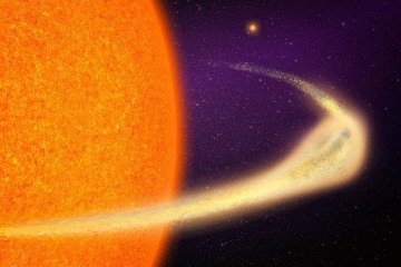 Um planeta em desintegração orbita uma estrela gigante. 'A extensão da cauda é gigantesca, chegando a 9 milhões de quilômetros de extensão', diz Marc Hon, pós-doutorando no Instituto Kavli de Astrofísica e Pesquisa Espacial do MIT -  (crédito: Jose-Luis Olivares/MIT)