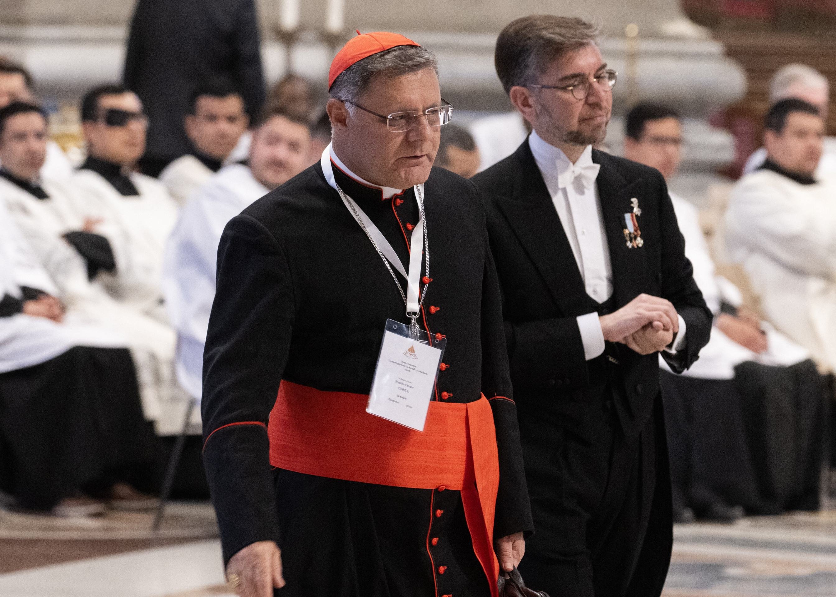  Brazilian Cardinal Paulo Cezar Costa (L) arrives to attend a mass in The Vatican, on April 30, 2025. (Photo by Tiziana FABI / AFP)       