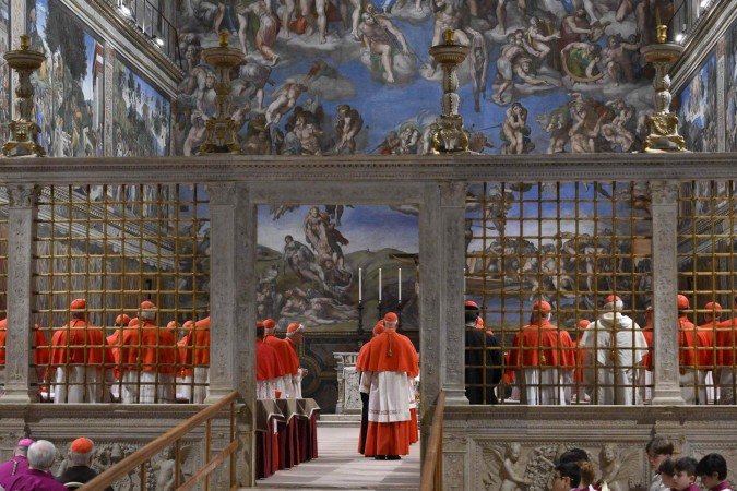  This photo taken and handout on May 7, 2025 by The Vatican Media shows cardinals before the start of the conclave to elect a new Pope in the Sistine chapel in The Vatican. (Photo by Mario Tomassetti / VATICAN MEDIA / AFP) / RESTRICTED TO EDITORIAL USE - MANDATORY CREDIT "AFP PHOTO / VATICAN MEDIA" - NO MARKETING - NO ADVERTISING CAMPAIGNS - DISTRIBUTED AS A SERVICE TO CLIENTS
      