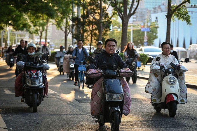 Os veículos de duas rodas são um meio de transporte extremamente popular na China - (crédito: Getty Images) Os veículos de duas rodas são um meio de transporte extremamente popular na China - (crédito: Getty Images)