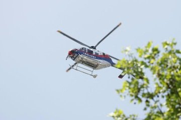  A police helicopter is seen in the air close to a school where, according to reports, several people died in a shooting, on June 10, 2025 in Graz, southeastern Austria. Several people died in a school shooting, including the attacker, Austrian broadcaster ORF quoted the interior ministry as saying. (Photo by ERWIN SCHERIAU / APA / AFP) / Austria OUT
      Caption 