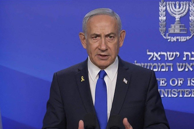 Benjamin Netanyahu divulgou um comunicado após o ataque israelense.
- (crédito: GPO/AFP) Benjamin Netanyahu divulgou um comunicado após o ataque israelense.
- (crédito: GPO/AFP)