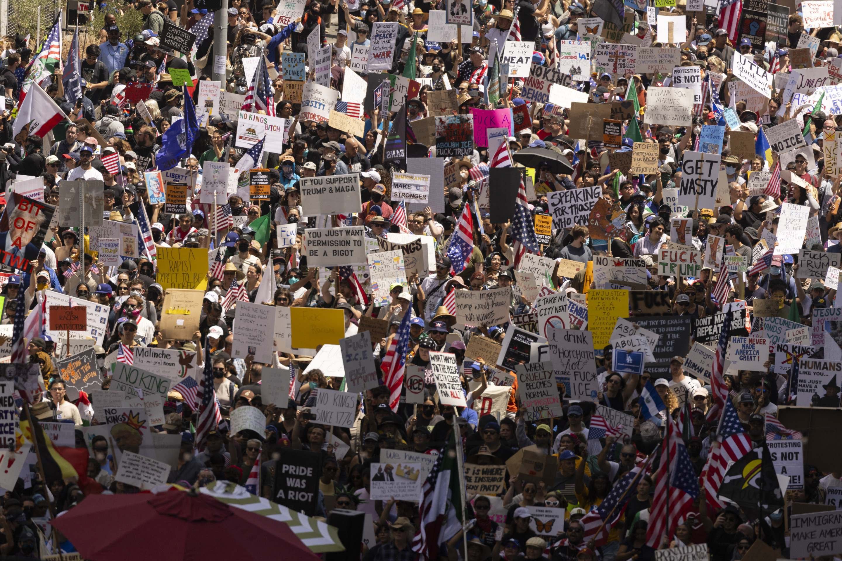  Demonstrators fill the streets as they protest the Trump administration during the 