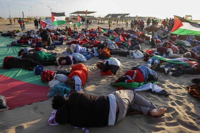  Demonstrators waving Palestinian flags hold a gathering to rename the Zuiderstrand beach as 