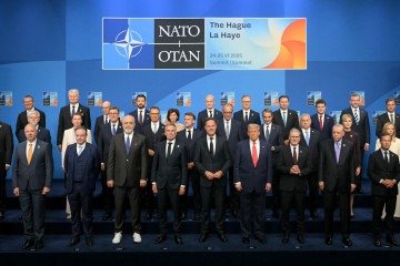  (Front row from 5L) Netherlands' Prime Minister Dick Schoof, NATO Secretary General Mark Rutte, US President Donald Trump, Britain's Prime Minister Keir Starmer, Turkey's President Recep Tayyip Erdogan pose NATO country leaders for a family photo during the North Atlantic Treaty Organization (NATO) Heads of State and Government summit in The Hague, on June 25, 2025. NATO leaders hold a two-day summit on June 24 and 25 in The Hague. (Photo by NICOLAS TUCAT / AFP)
      