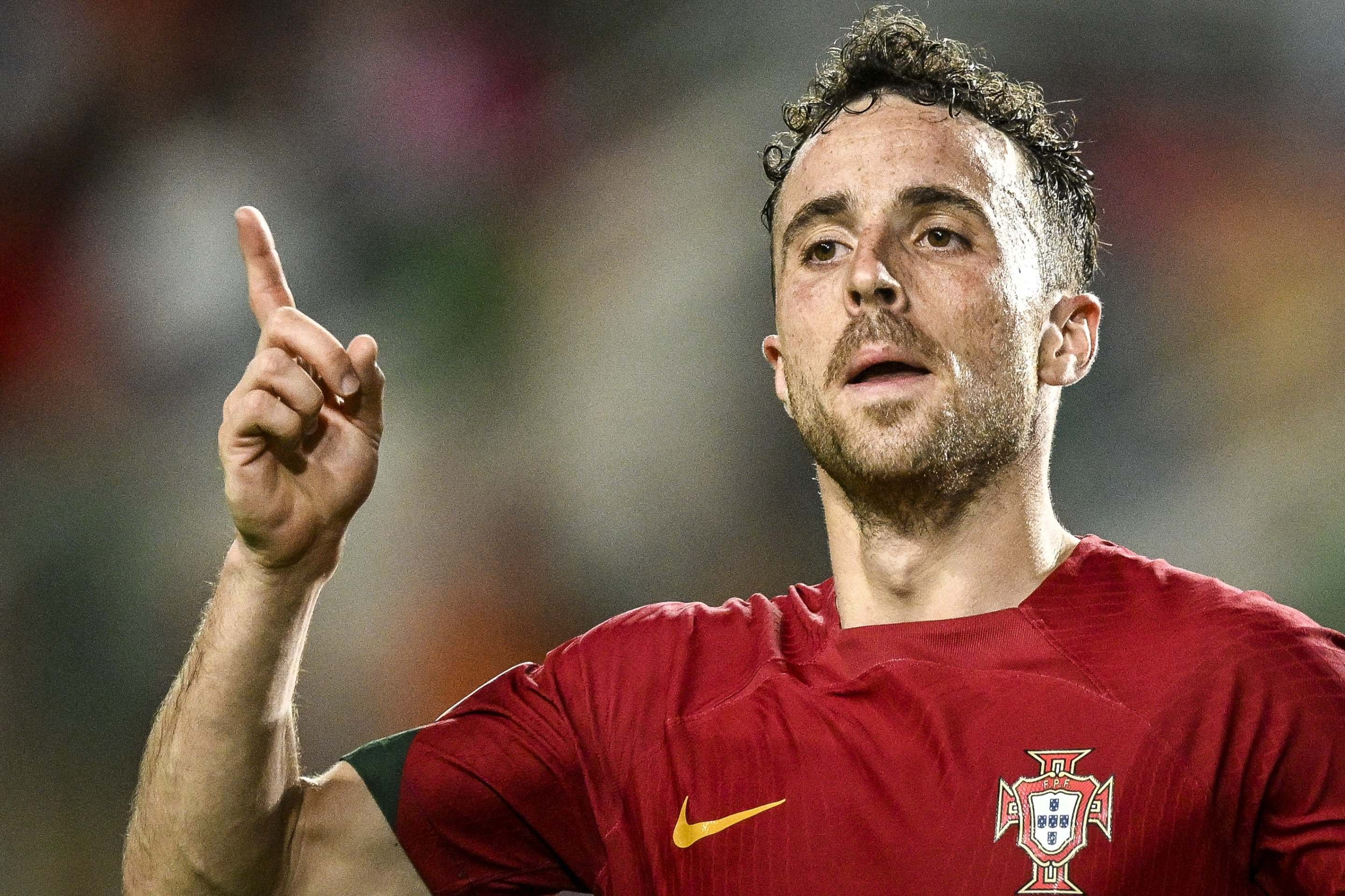  (FILES) Portugal's forward #21 Diogo Jota celebrates after scoring a goal during the EURO 2024 first round group J qualifying football match between Portugal and Luxembourg at the Algarve stadium in Almancil, Faro district, on September 11, 2023. Liverpool striker Diogo Jota died along with his brother early July 3, 2025 in a road accident in northwest Spain, the Spanish Civil Guard said. The accident occurred around 12:30 a.m. on a highway in the province of Zamora. The vehicle "left the road" before bursting into flames, the Civil Guard said, adding that the two passengers, Diogo Jota and his brother Andre Felipe, also a professional footballer, were deceased. (Photo by Patricia DE MELO MOREIRA / AFP)       