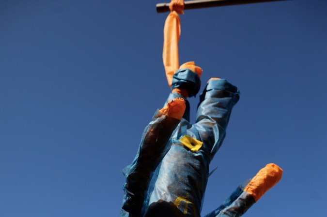  A doll representing US President Donald Trump hangs from a stick during a demonstration called by the National Student Union (UNE) against the US government trade taxes and sanctions on Brazil, in front of the US embassy in Brasilia on August 1, 2025. Trump’s Brazil tariff is among the highest imposed on US trading partners, and unlike with other countries, the measures have been framed in openly political terms, sweeping aside centuries-old trade ties and a surplus that Brasilia put at $284 million last year. (Photo by SERGIO LIMA / AFP)      