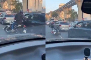 Momento em que o motorista reage à tentativa de assalto no Brooklin; o criminoso, armado em uma moto, morreu após ser levado ao hospital -  (crédito: Reprodução / X)