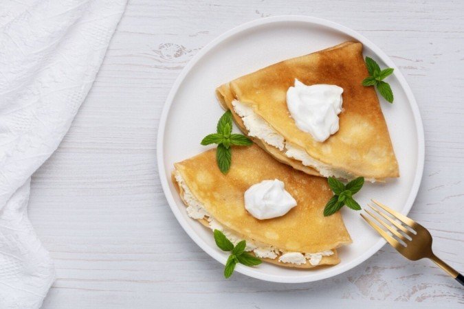 Panqueca com queijo cottage (Imagem: NataliaPopova | Shutterstock) - (crédito: EdiCase) Panqueca com queijo cottage (Imagem: NataliaPopova | Shutterstock) - (crédito: EdiCase)