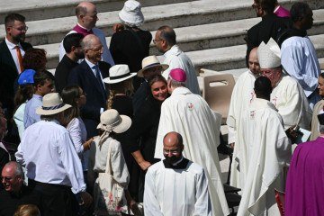 Mother of late Carlo Acutis, Antonia Salzano (C) is greeted by a member of the clergy after a Holy Mass and canonisation of Blessed Carlo Acutis and Pier Giorgio Frassati in St Peter's Square at the Vatican on September 7, 2025. An Italian teenager dubbed 
