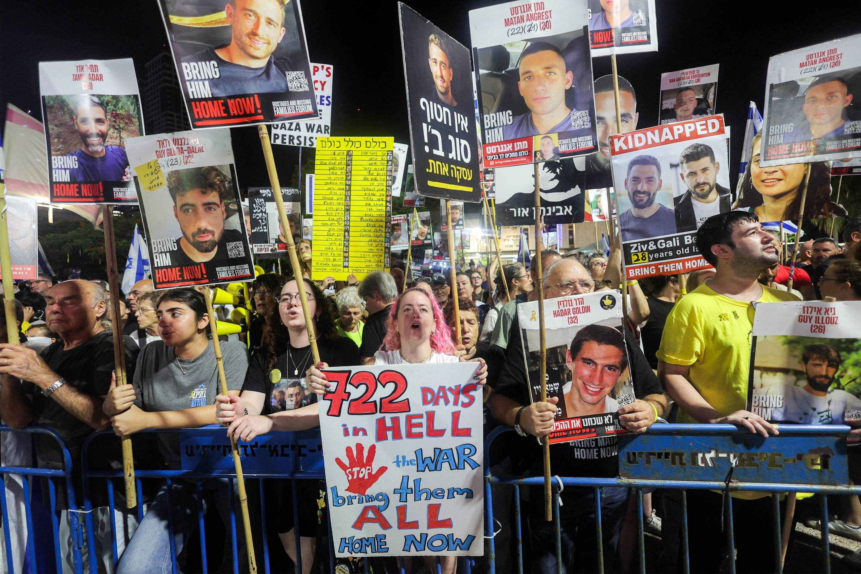  Demonstrators gather during an anti-government protest organised by the families of the Israeli hostages taken captive in the Gaza Strip since the October 2023, marking 722 days of the ongoing war between Israel and Palestinian militant movement Hamas, calling for a ceasefire and for action to secure the hostages release, outside the Tel Aviv Museum of Art (known as the 