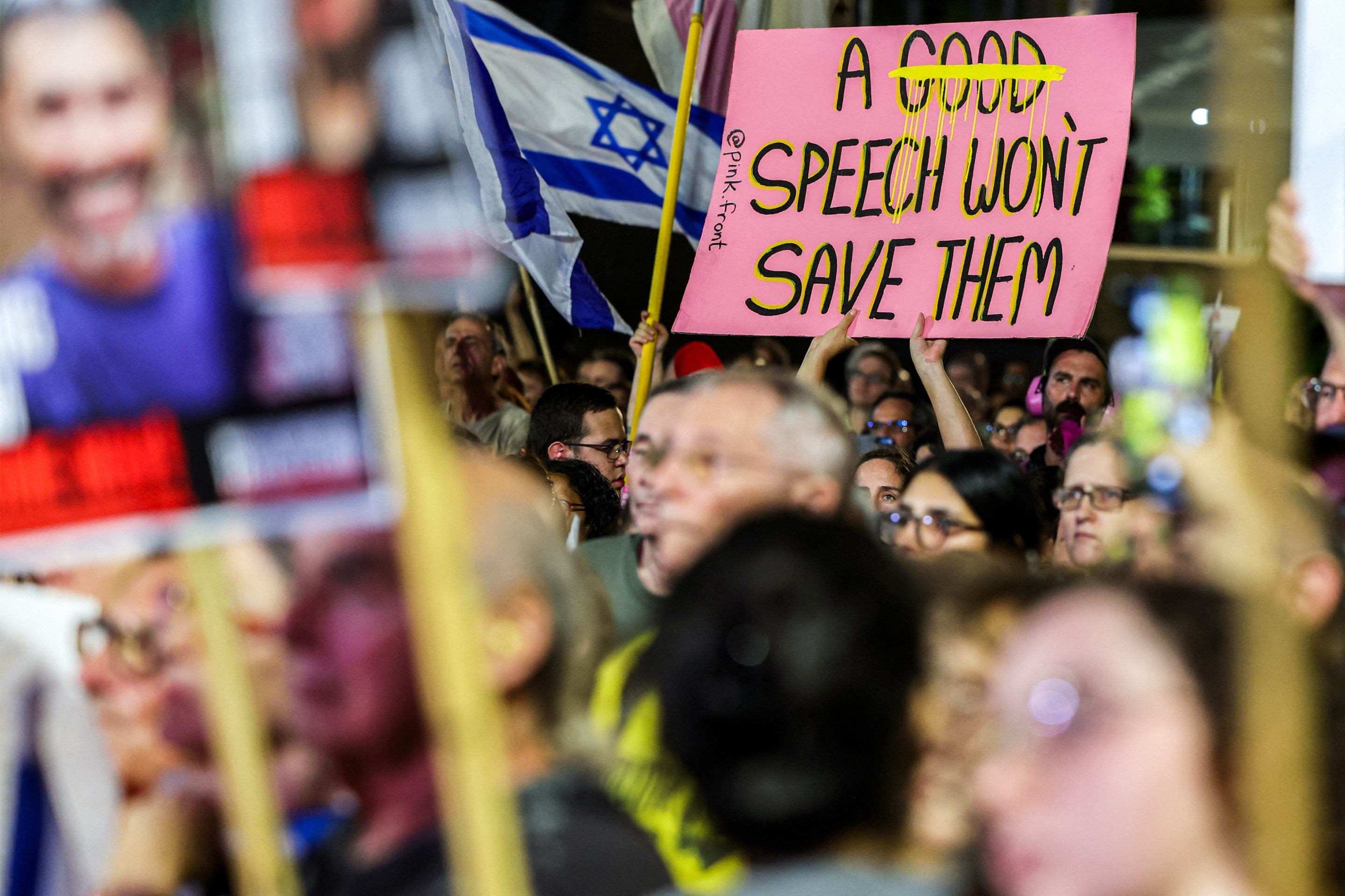  A demonstrator holds a sign referencing the Israeli prime ministers speech at the United Nations General Assembly the previous day, during an anti-government protest organised by the families of the Israeli hostages taken captive in the Gaza Strip since the October 2023, marking 722 days of the ongoing war between Israel and Palestinian militant movement Hamas, calling for a ceasefire and for action to secure the hostages release, outside the Tel Aviv Museum of Art (known as the 