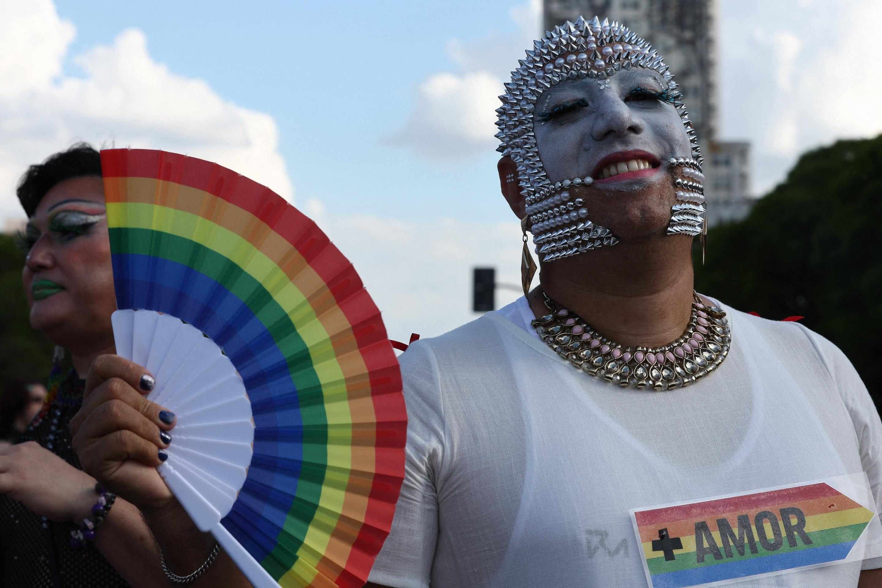  A reveller takes part in the 34th Pride Parade in Buenos Aires on November 1, 2025. (Photo by Alejandro PAGNI / AFP)       