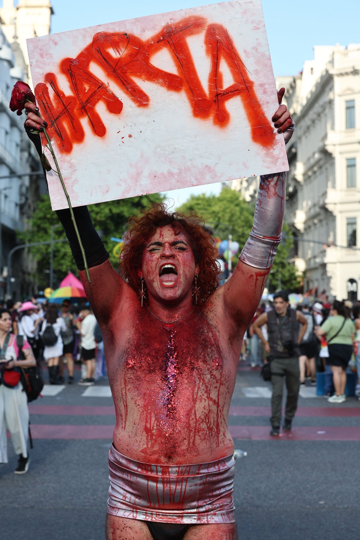  A reveller covered in red paint takes part in the 34th Pride Parade in Buenos Aires on November 1, 2025. (Photo by Alejandro PAGNI / AFP)       