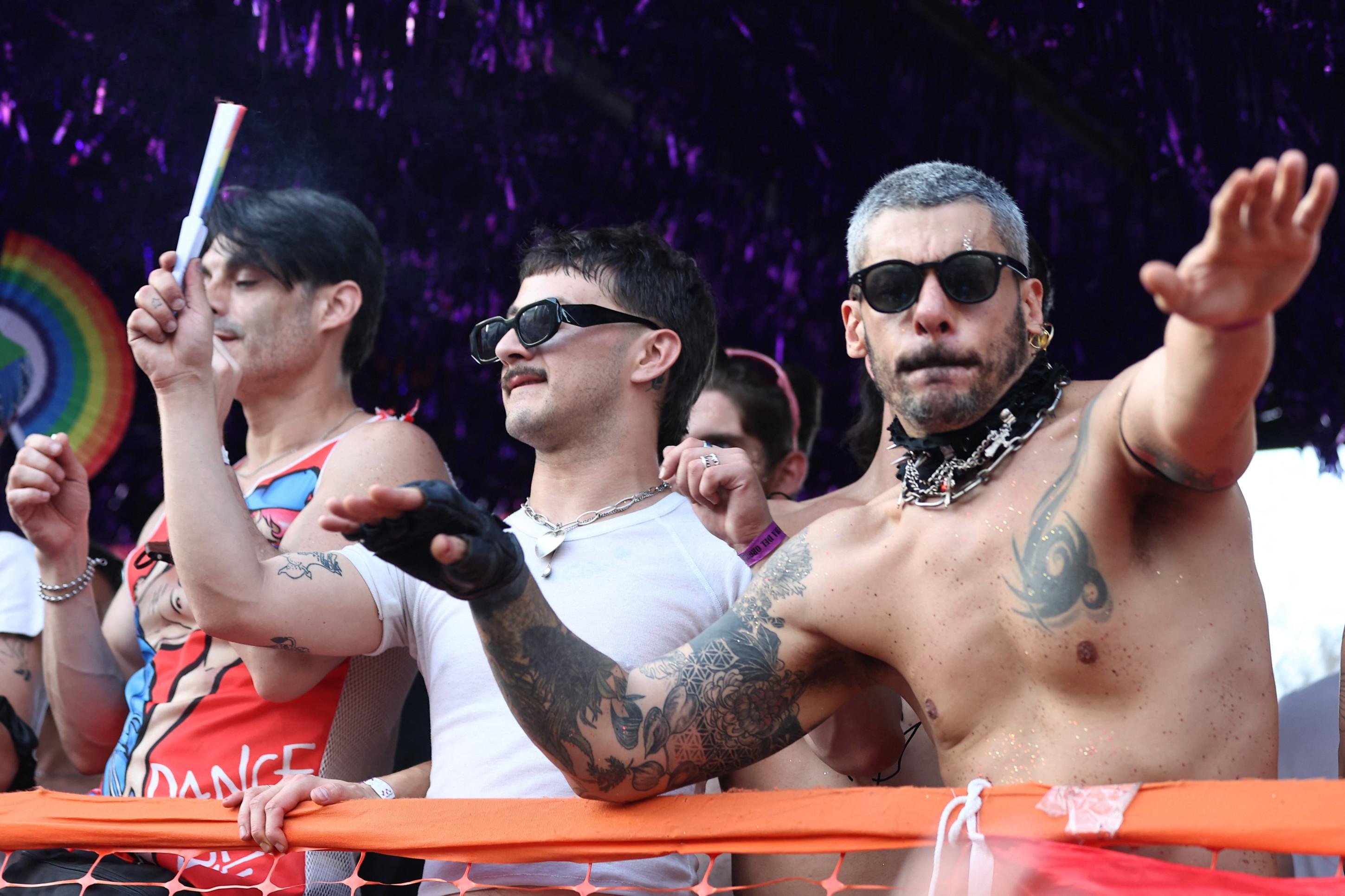  Revellers take part in the 34th Pride Parade in Buenos Aires on November 1, 2025. (Photo by Alejandro PAGNI / AFP)       